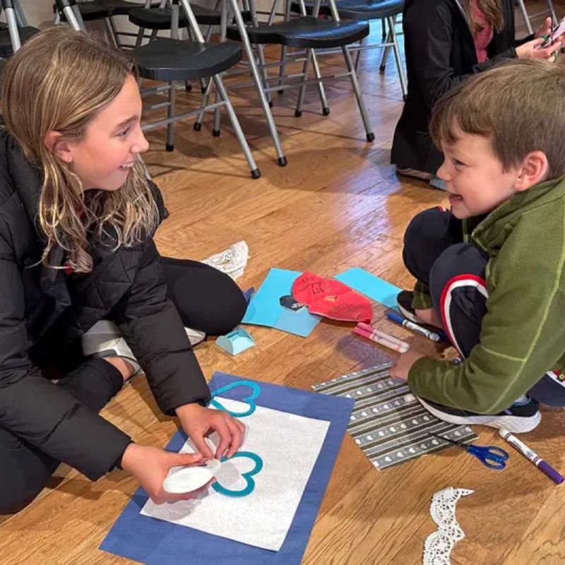 Grades 1 and 8 team up to spread love on Valentine's Day