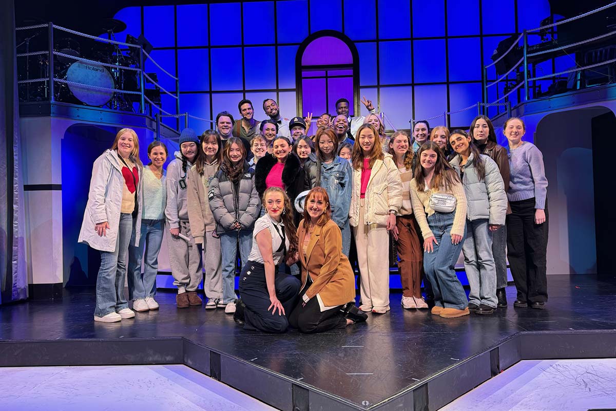 Catalina students pose on stage with the New York City cast of "Titanique."